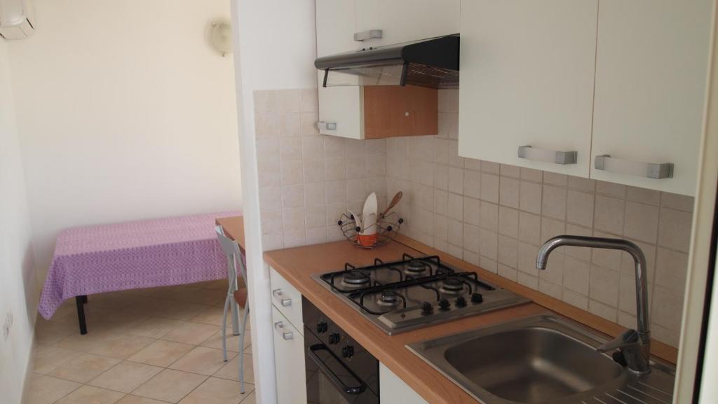 Kuchyň nebo kuchyňský kout v ubytování Case vacanza Torre Mozza Ugento Afr0dite