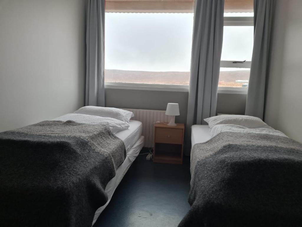 Postel nebo postele na pokoji v ubytování Hótel Hvítserkur