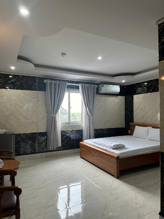Postel nebo postele na pokoji v ubytování Thulee Luxury Hotel - Phu My