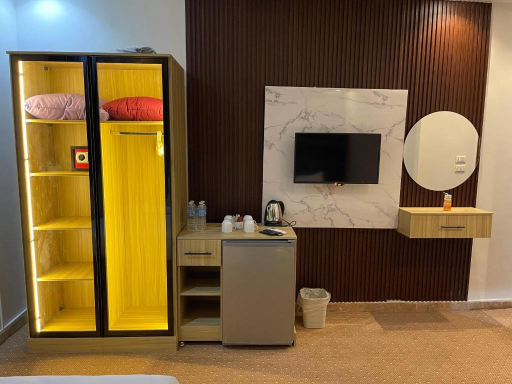 TV a/nebo společenská místnost v ubytování Giza Pyramids Boutique Hotel