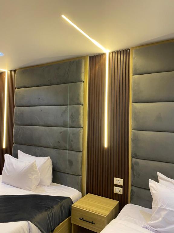 Postel nebo postele na pokoji v ubytování Giza Pyramids Boutique Hotel
