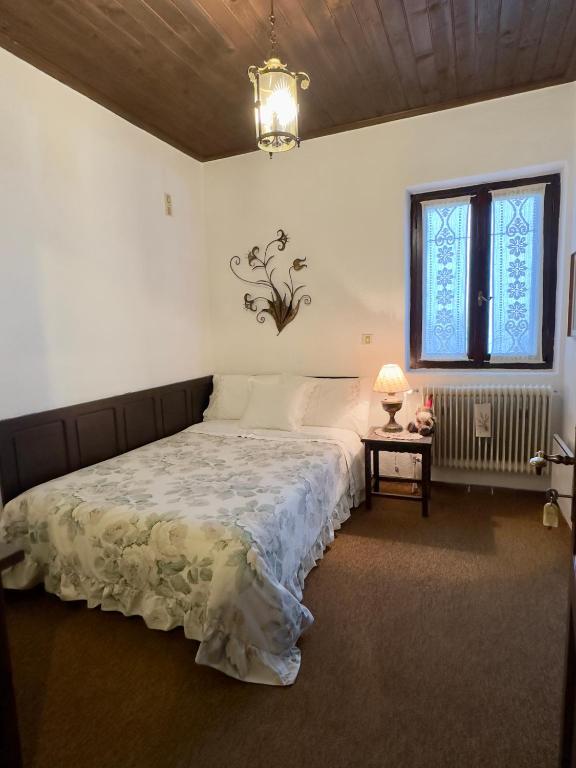 Postel nebo postele na pokoji v ubytování ΤΟ ΑΡΧΟΝΤΙΚΟ