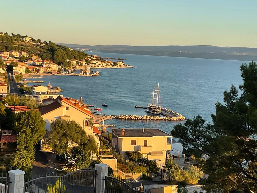 a view of a harbor with a boat in the water at Vila Fjaka in Dugi Rat
