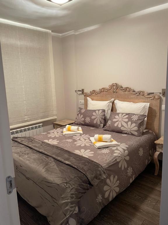 Posteľ alebo postele v izbe v ubytovaní Apartamentos Solneu