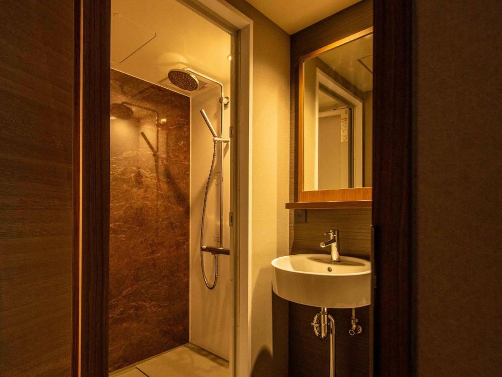 Koupelna v ubytování New Osaka Hotel