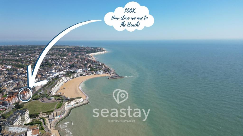 an aerial view of a beach with the words just the day we ate the beach at Eva's Sea View 2 Bed 2 Bath Parking in Kent