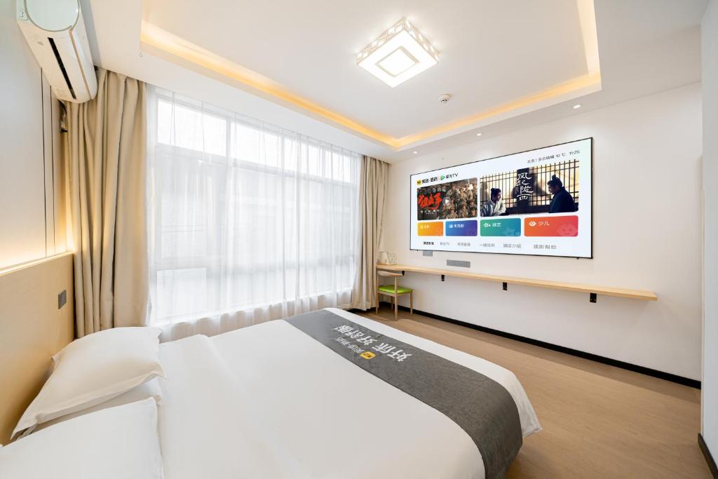 Postel nebo postele na pokoji v ubytování Shanghai Lanfeng Intelligent Light - Shanghai Disney Branch