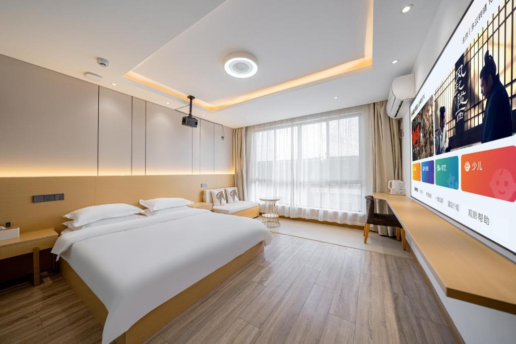TV a/nebo společenská místnost v ubytování Shanghai Lanfeng Intelligent Light - Shanghai Disney Branch