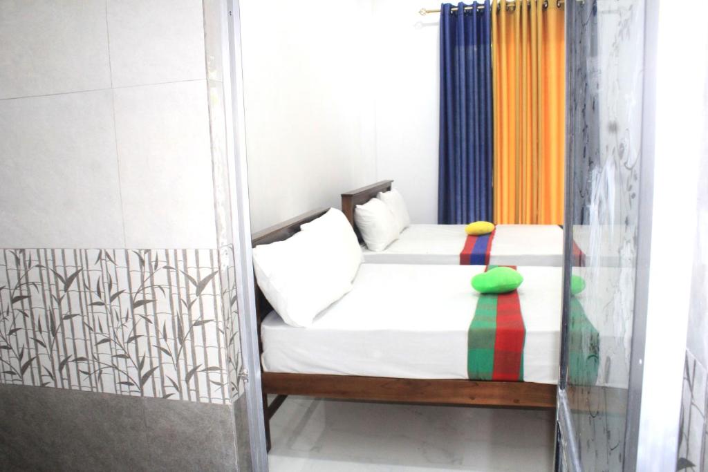 Postel nebo postele na pokoji v ubytování Sigiriya Mana B&B