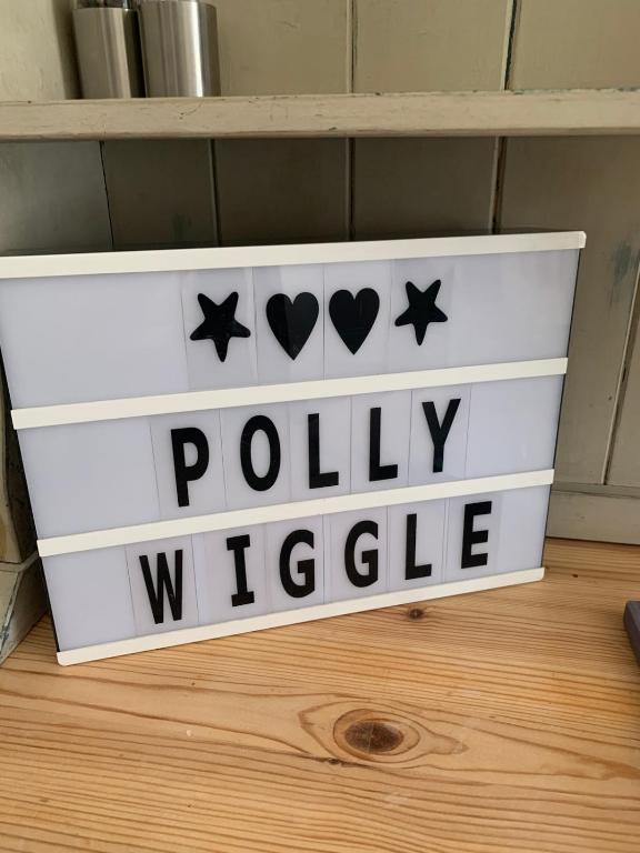 a white box with the words politically visible on it at Pollywiggle Cottage, Dog Friendly cottage in Heacham in Heacham
