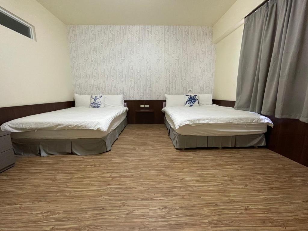 Postel nebo postele na pokoji v ubytování 回家浪