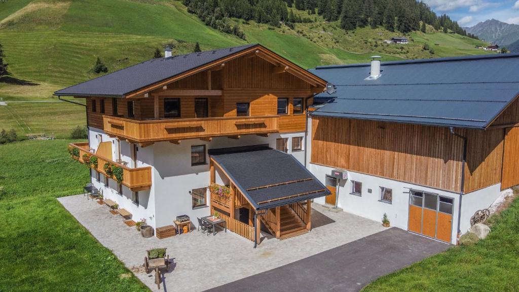 an aerial view of a house with a barn at Nedererhof - Ferienwohnung Hoamat in Schmirn