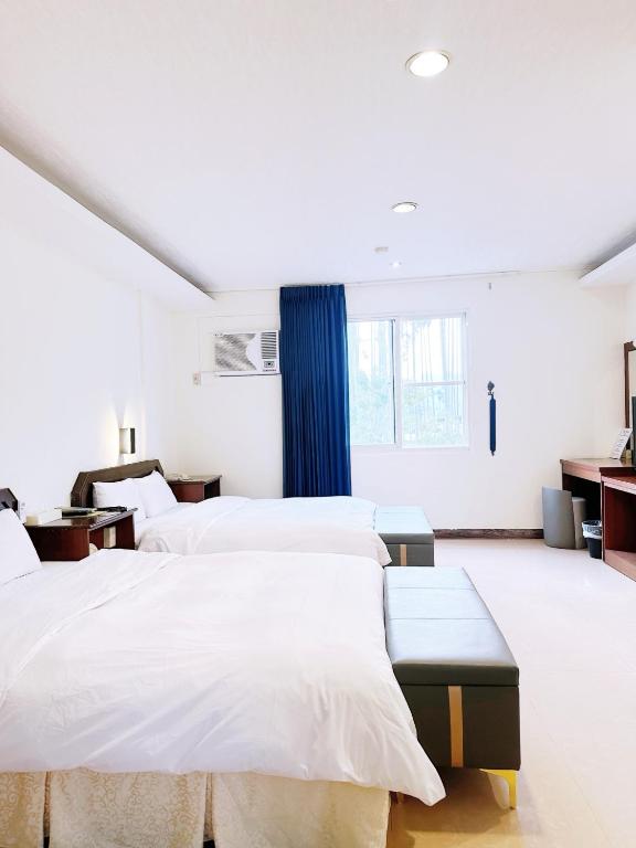 Postel nebo postele na pokoji v ubytování Hua Du Motel