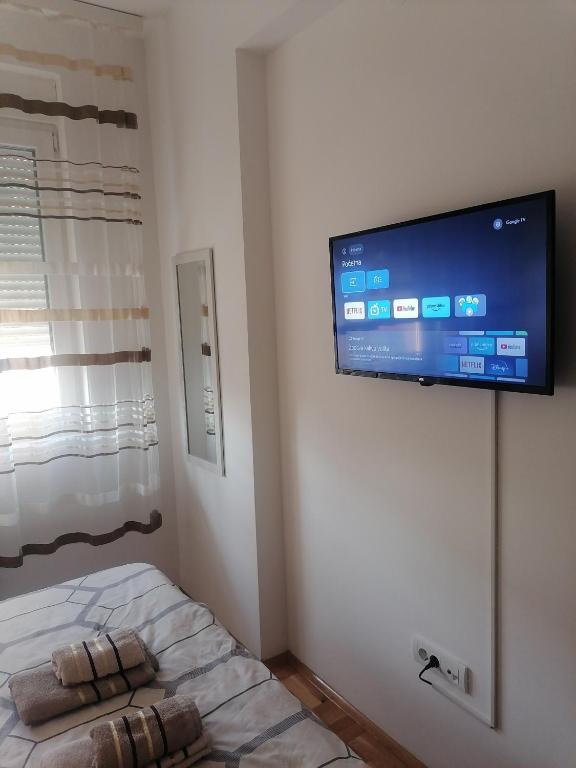 Postel nebo postele na pokoji v ubytování Apartman Zapadni Kej Pirot