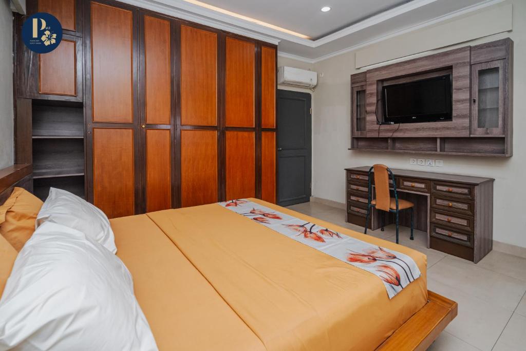 Postel nebo postele na pokoji v ubytování Bali Puspa Guest House