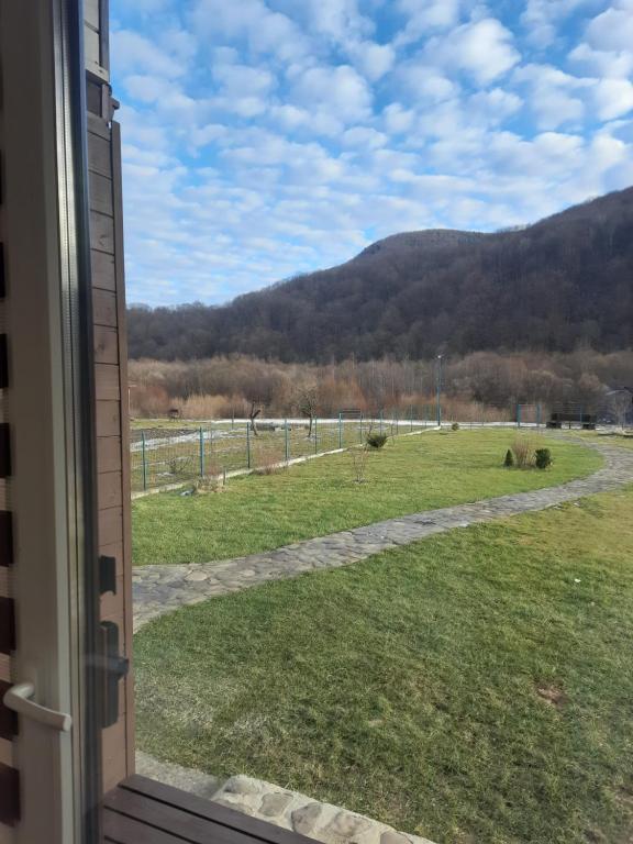 a view of a field from a window at Villa Opir in Skole