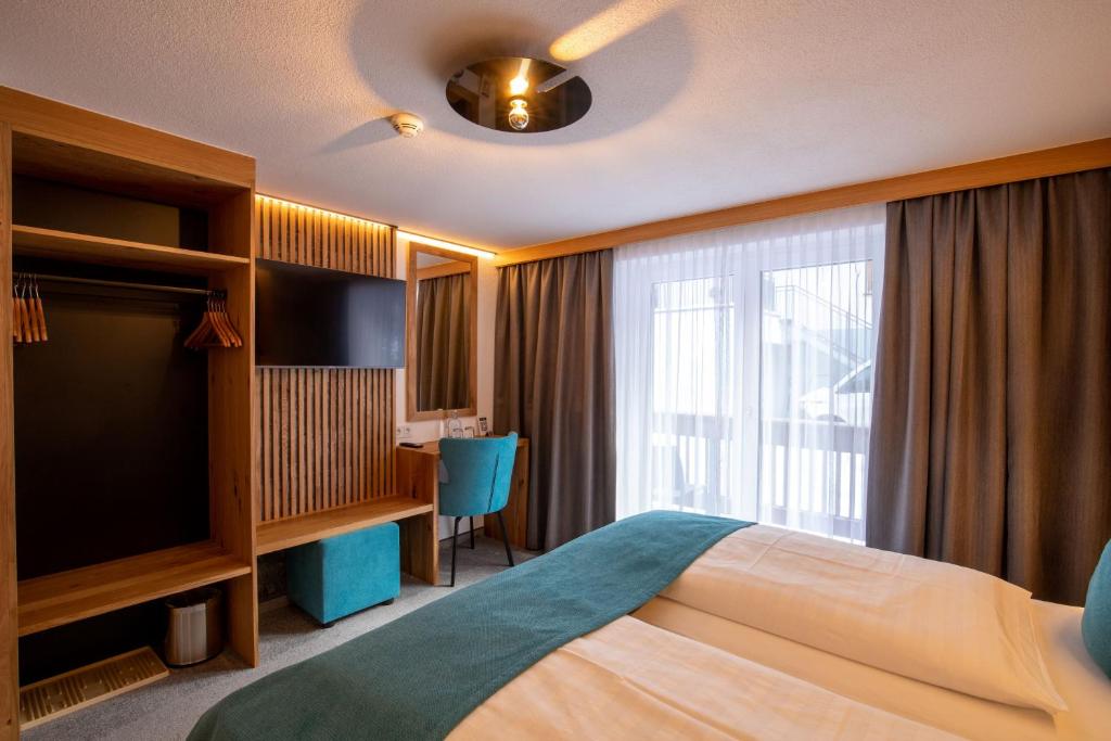 Posteľ alebo postele v izbe v ubytovaní Hotel Garni Subretta