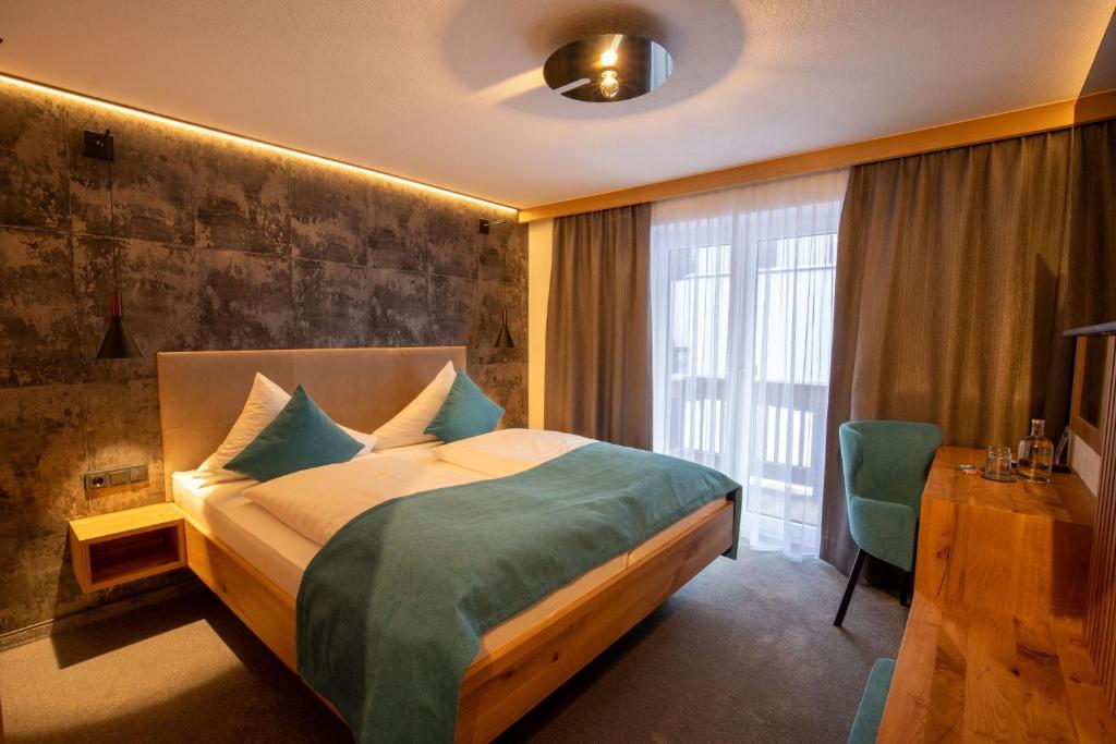Posteľ alebo postele v izbe v ubytovaní Hotel Garni Subretta