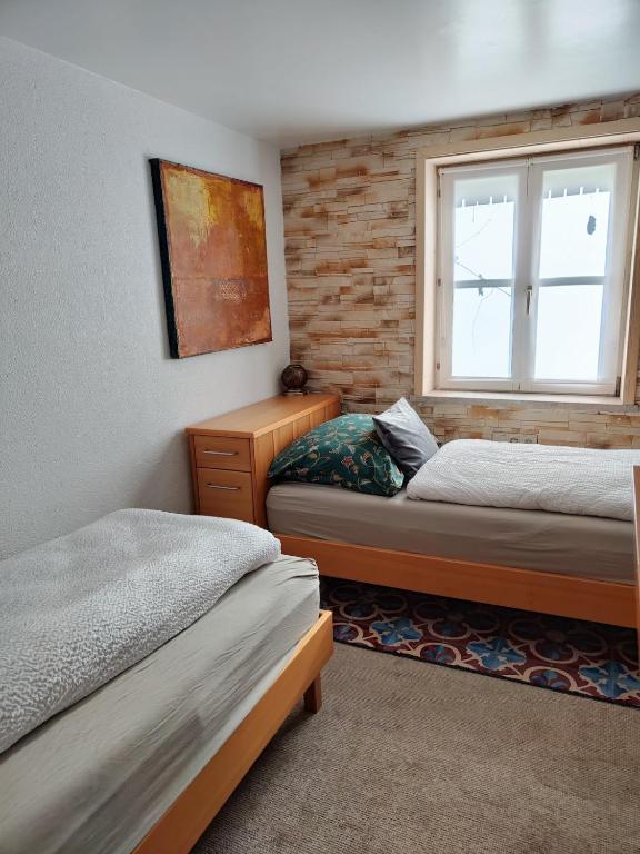 Postel nebo postele na pokoji v ubytování Gemütliches 2 Bettzimmer mit Gemeinschaftsbad und kleiner Küche