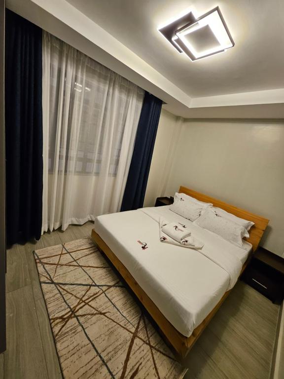 Postel nebo postele na pokoji v ubytování Lumo Residences Eldoret