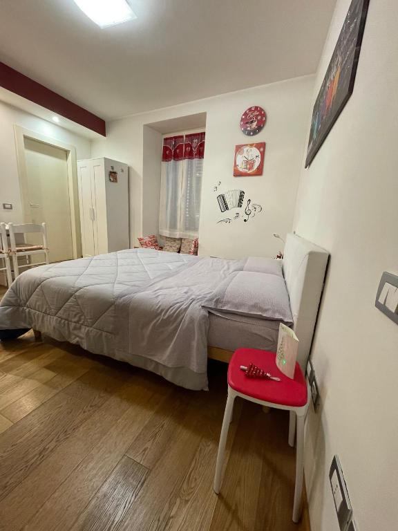 Postel nebo postele na pokoji v ubytování B&B La Fisarmonica
