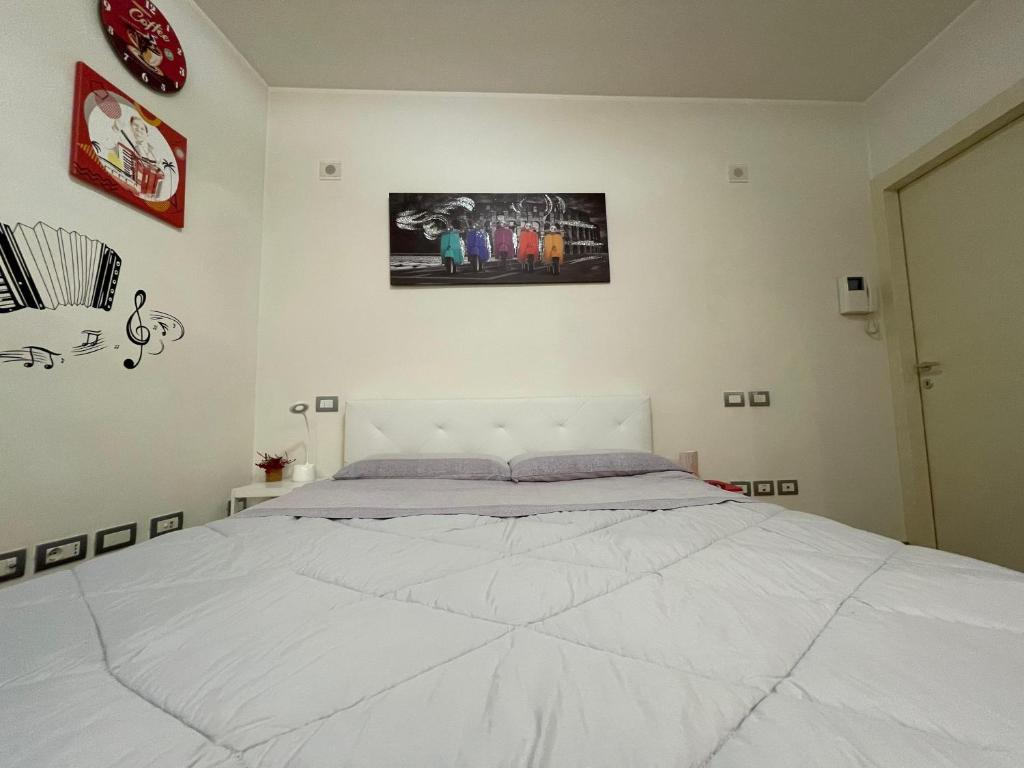 Postel nebo postele na pokoji v ubytování B&B La Fisarmonica