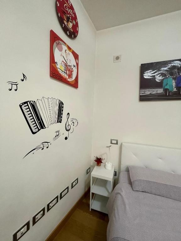 Postel nebo postele na pokoji v ubytování B&B La Fisarmonica