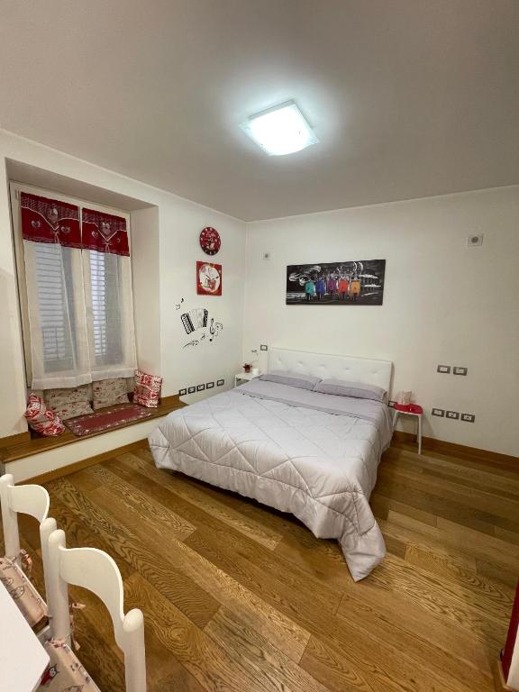 Postel nebo postele na pokoji v ubytování B&B La Fisarmonica