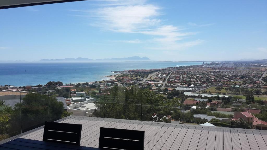 a view of a city and the ocean from a roof at Villa Lucca in Cape Town