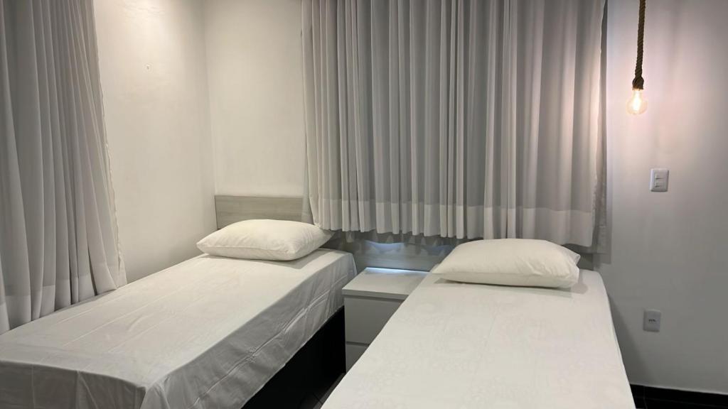 Postel nebo postele na pokoji v ubytování CARIBESSA BEIRA MAR CLUBE Aspep