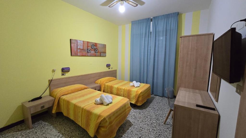 Postel nebo postele na pokoji v ubytování Abc Hotel