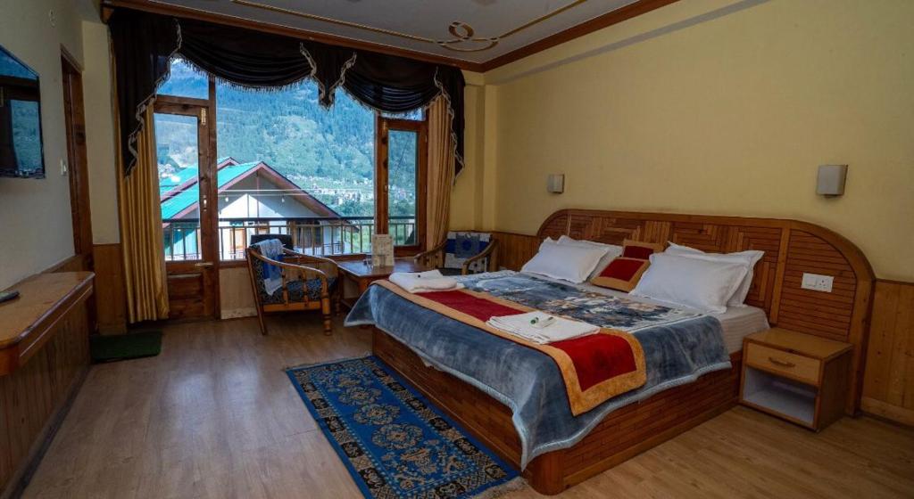 Ένα ή περισσότερα κρεβάτια σε δωμάτιο στο Sunrise Manali