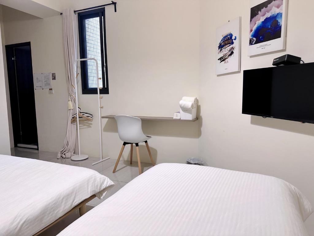Postel nebo postele na pokoji v ubytování 補夢網民宿