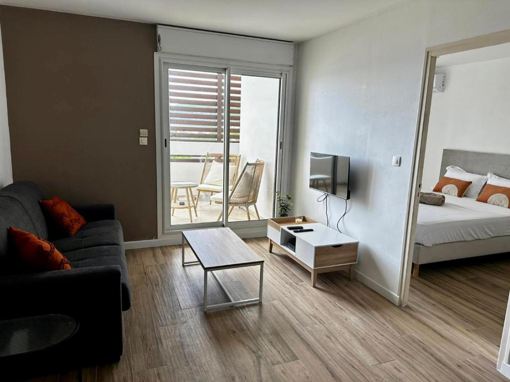 Postel nebo postele na pokoji v ubytování Bel appartement vue mer - Mafat'appart