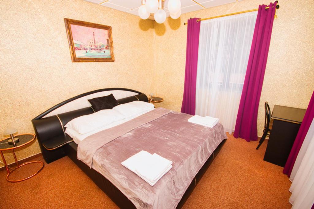 Postel nebo postele na pokoji v ubytování Hotel KILIÁN