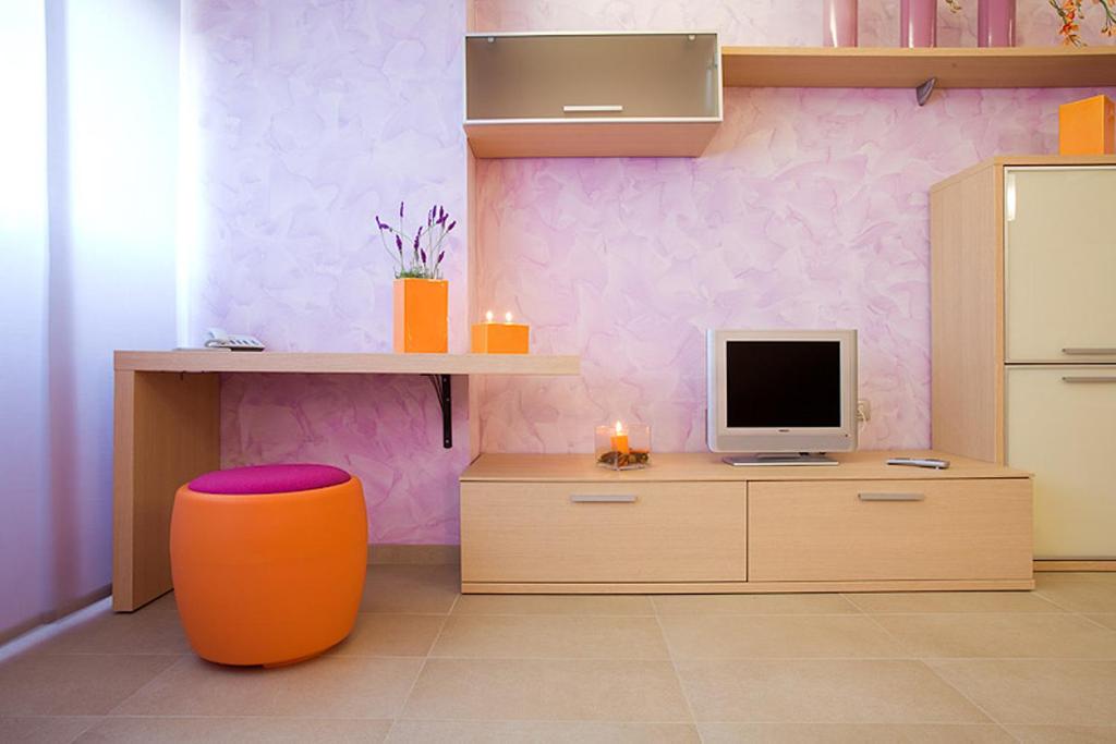 TV a/nebo společenská místnost v ubytování Le Onde Resort