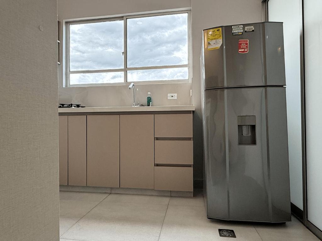 Kuchyň nebo kuchyňský kout v ubytování Lindo Apartamento con Jacuzzi en Monteria