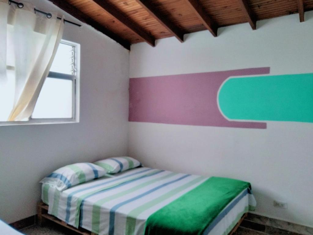 Postel nebo postele na pokoji v ubytování Hostal paz y vida