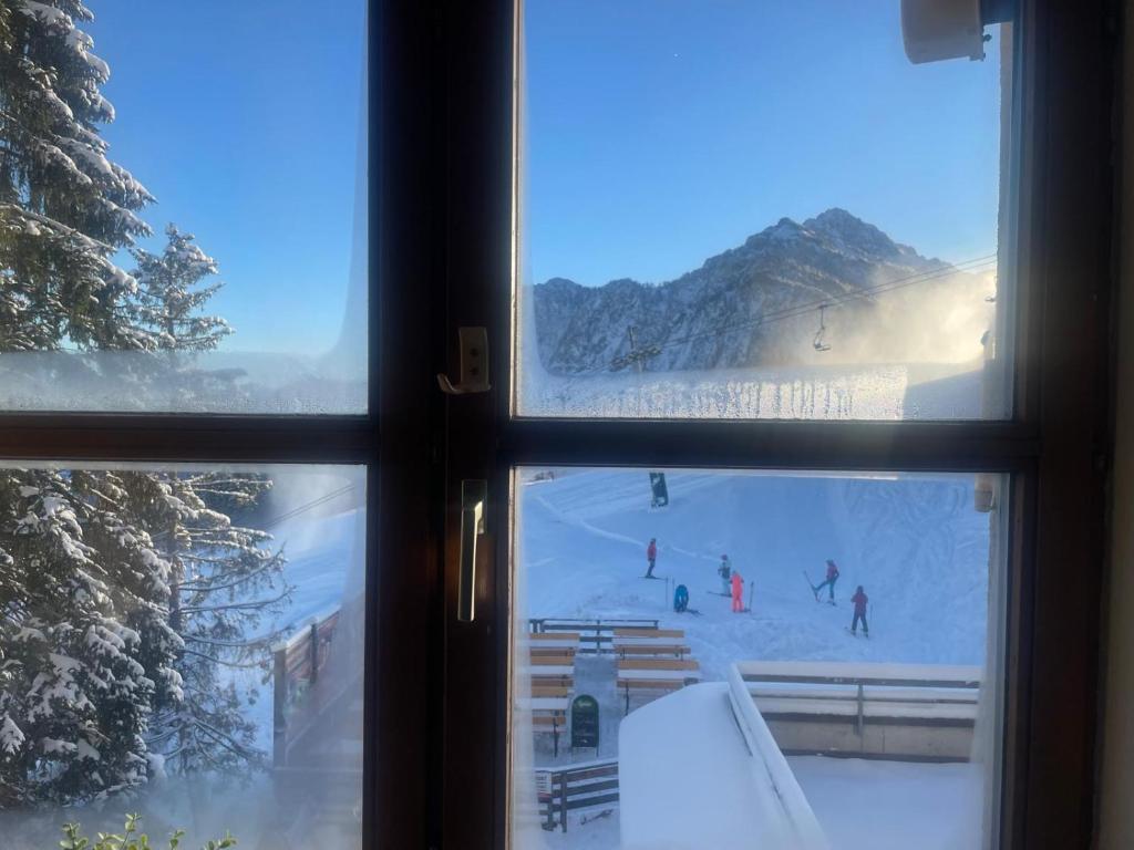 a view of a ski slope from a window at Sunshine Sara Sonnleitn - Nassfeld in Hermagor