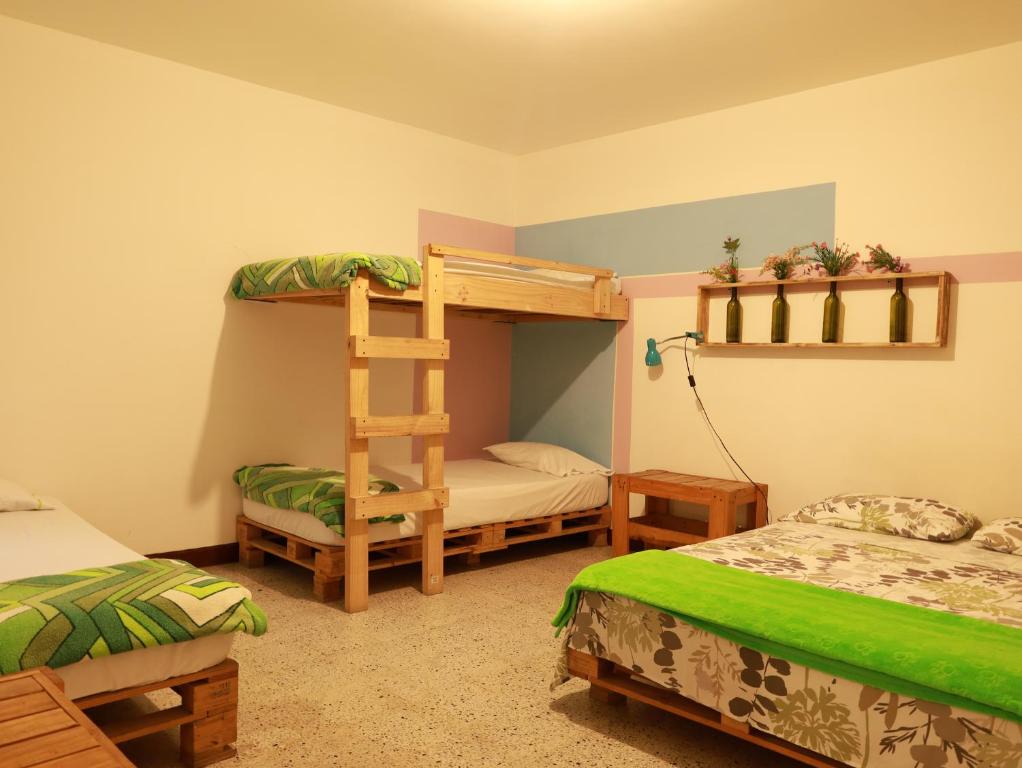 Postel nebo postele na pokoji v ubytování Hostal paz y vida
