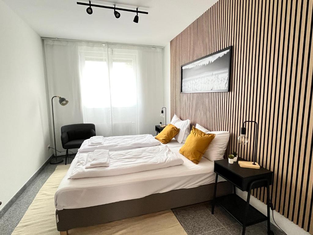 Ένα ή περισσότερα κρεβάτια σε δωμάτιο στο LTA Apartment München Süd No3 Friends & Family