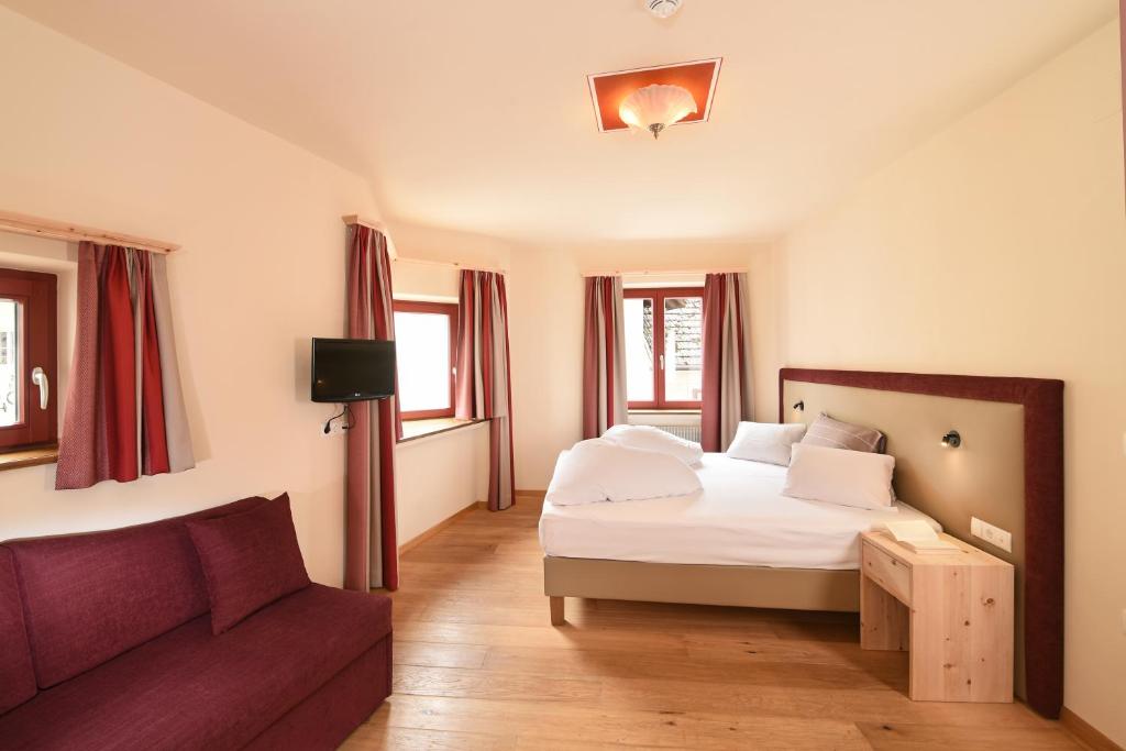 Postel nebo postele na pokoji v ubytování Hotel Gassenwirt