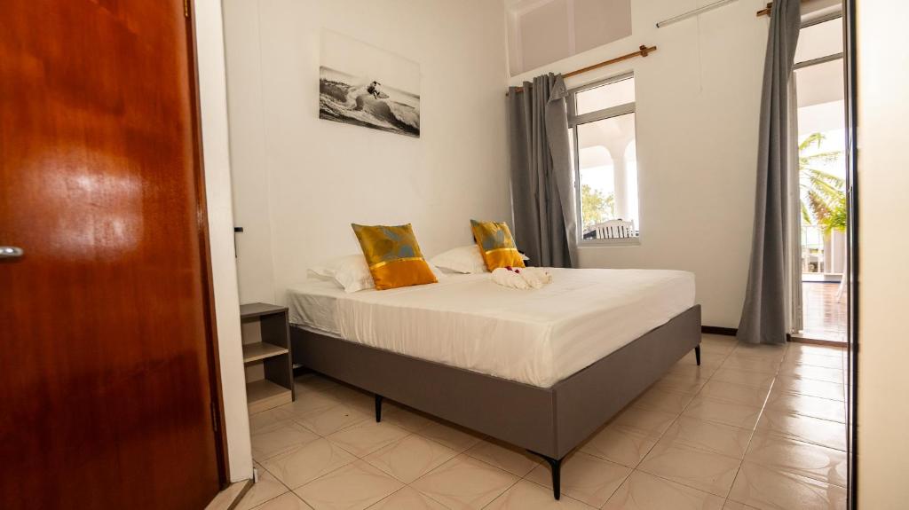 Postel nebo postele na pokoji v ubytování La Plage Residence