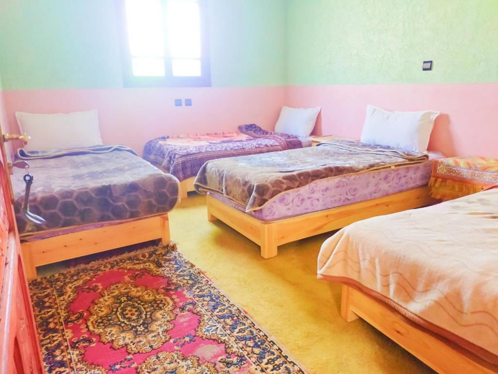 Postel nebo postele na pokoji v ubytování Gîte akioud mazik