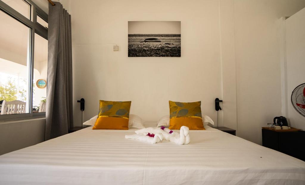 Postel nebo postele na pokoji v ubytování La Plage Residence