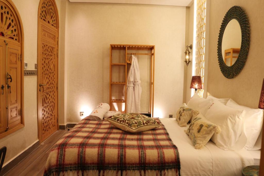 Postel nebo postele na pokoji v ubytování Riad AL FIDAN
