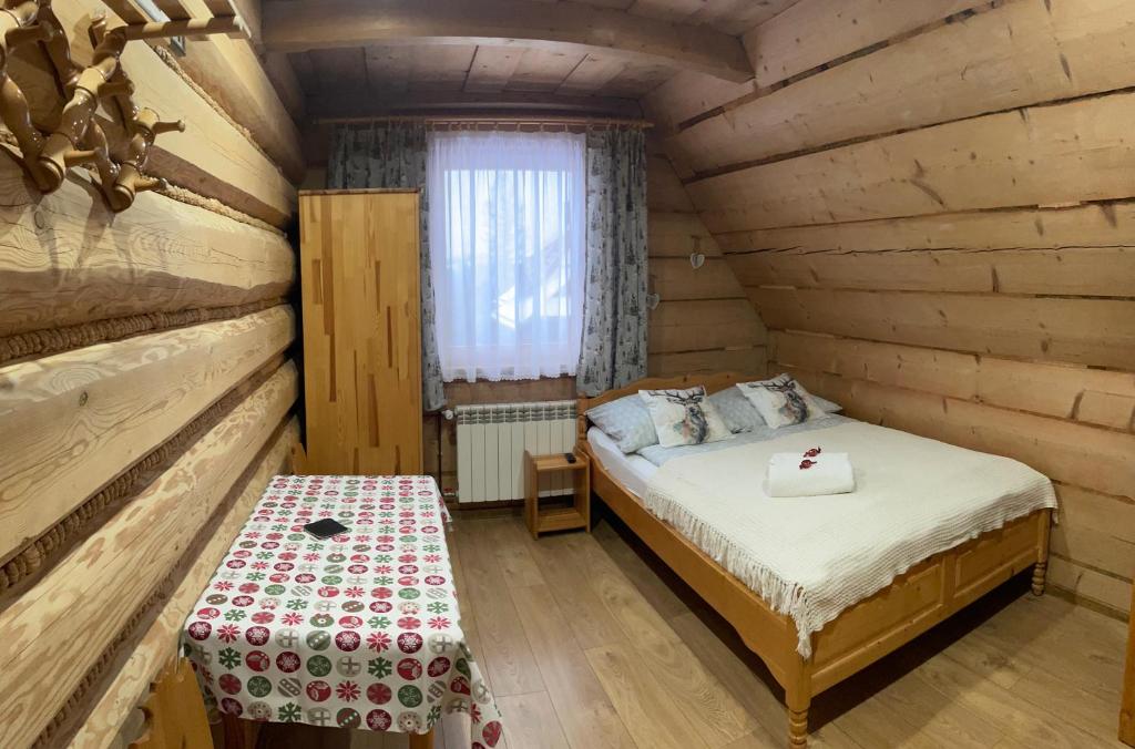 Posteľ alebo postele v izbe v ubytovaní Pokoje regionalne u Ani