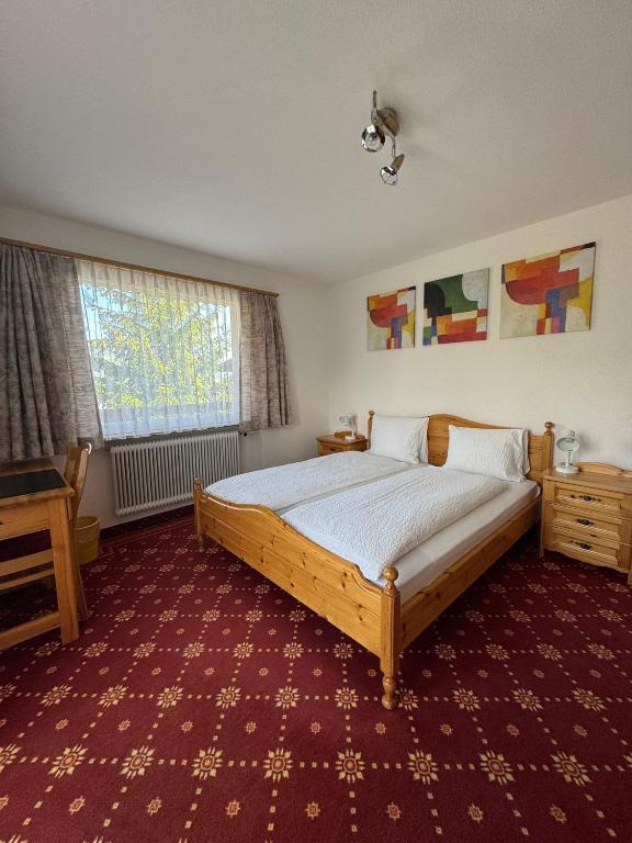 Postel nebo postele na pokoji v ubytování Hotel Alpina