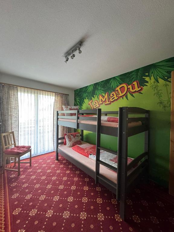 Postel nebo postele na pokoji v ubytování Hotel Alpina