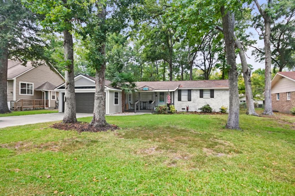 a house with trees in the yard at Golfers beach bungalow in Myrtle Beach